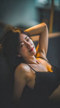 Beautiful young woman lying down resting with relaxed pose photo
