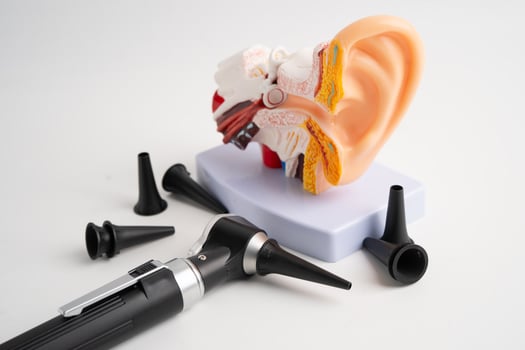 Otoscope isolated on white background for otolaryngologist or ENT physician doctor examining senior patient ear, hearing loss problem. photo
