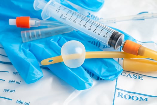 Foley catheter and urine drainage bag collect urine for disability or patient in hospital. photo