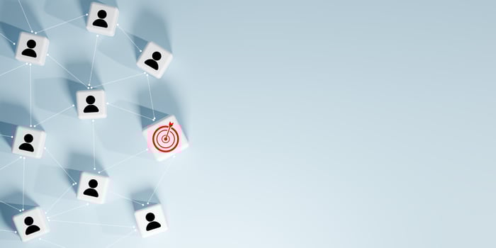 3D render of a network of interconnected white cubes with black person icons and one red target icon, symbolizing social networking, audience targeting, business goals, leadership, and strategic focus photo