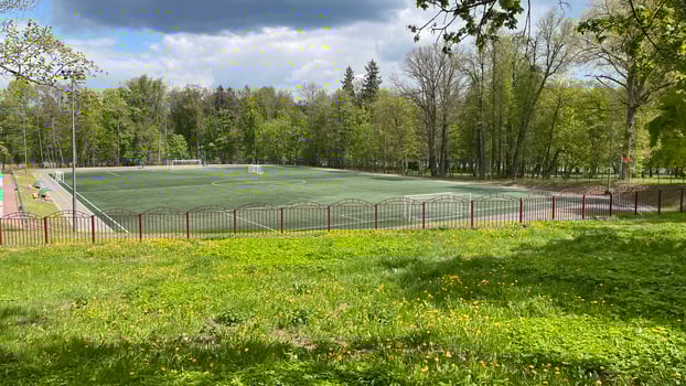 A soccer field in the middle of a green field photo