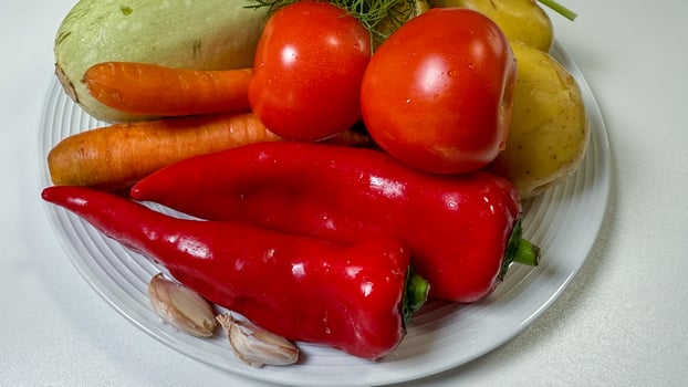 A vibrant medley of sun kissed vegetables resembling a rustic harvest feast, evoking Lammas festival or National Veggie Day photo