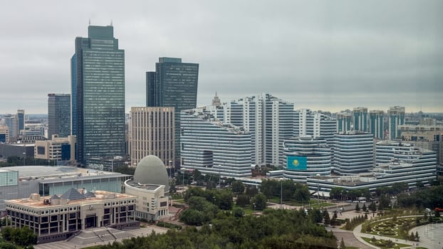 Futuristic skyline under moody skies, echoing Central Asian architecture, perfect for Harmony Day reflections or urban wanderlust musings photo