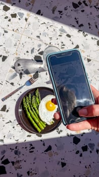 Sunlit brunch moment captured, asparagus and egg symphony, digital observance, Easter brunch vibes meet World Photography Day creativity photo