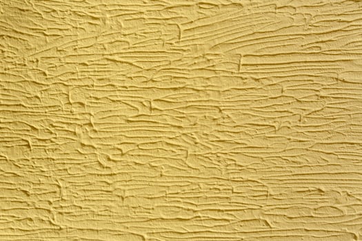 A wall with a white paint that has a texture. The texture is made up of lines. photo