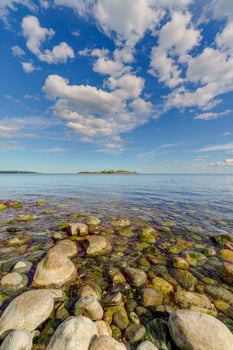 Beautiful stones in clear lake water. Wildlife landscape. photo