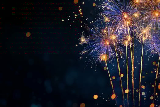 Colorful Fireworks Burst in the Night Sky During a Celebration photo