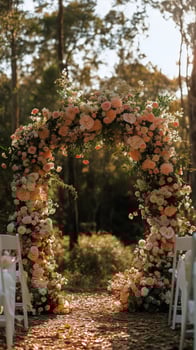 Beautiful Floral Arch at a Serene Outdoor Wedding Ceremony in Nature During Golden Hour photo