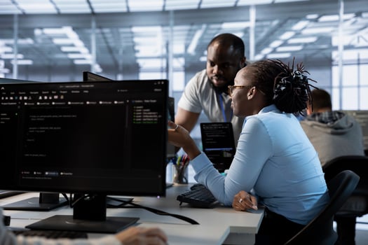 Team of engineers talking in server hub, ensuring compliance with industry standards and regulatory requirements. Data center teamworking colleagues conducting security audits photo