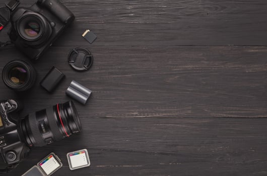 Photo equipment frame. Top view of diverse personal equipment for photographer or creative designer, copy space