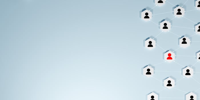 A network of connected blocks with black human icons, highlighting one red icon, on light blue background, symbolizing community, social networking, finding individuals, and digital interconnectedness photo