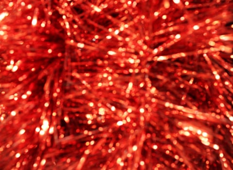 Red Christmas tinsel close-up. Red New Year Christmas Background photo