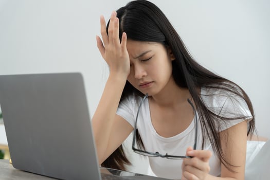 Eye problem., Asian women with tired and irritated eyes, eye rubbing, dry, eye pain after work, migraine, headache, blurred vision, photophobia, working in the dark. blue light from computer screen. photo