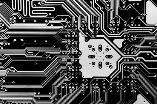 Close-up of a printed computer circuit board. Computer motherboard, macro shot. Abstract futuristic background photo