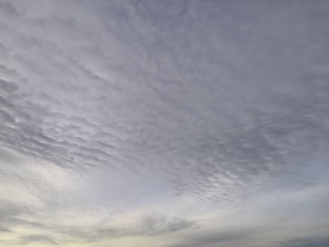A view of the sky with clouds and a boat photo