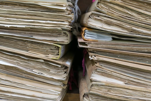 A stack of old documents on a table photo