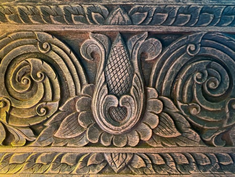 An ornate carving on a wall photo