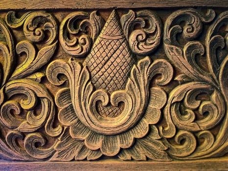 Carved wood panel with floral design photo