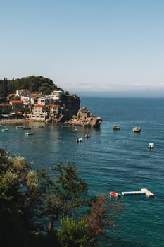 Amazing view of Przno and the Adriatic sea near Budva, Montenegro on a summer day. Travel destination in Montenegro. photo