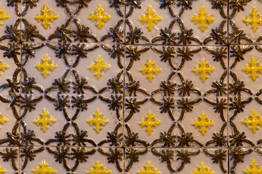 Intricate Yellow and Brown Ceramic Tile Pattern with Star Motifs photo