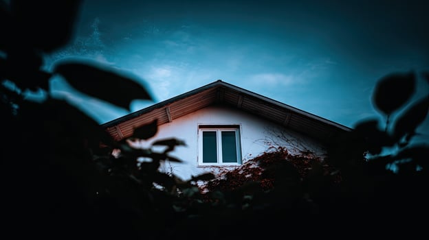 A house with a window in the dark photo