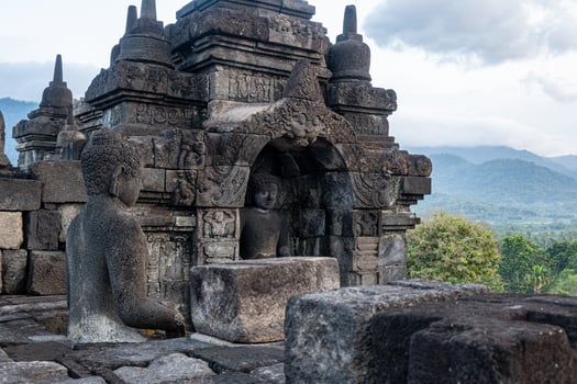 Stone Carved Buddha Statues at Borobudur Temple in Central Java photo