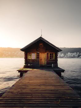 Wooden Cabin on a Lake at Sunset Tranquil Lakeside Retreat. photo