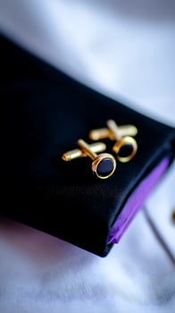Gold Cufflinks with Black Onyx on a Black Cuff Case. A close up image of elegant men's accessories. photo