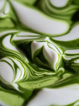 Abstract Swirls of Matcha Green Tea and Cream A Close Up of Textured Beverage. photo