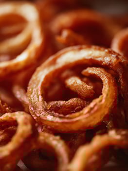 Close up of Crispy Golden Onion Rings, Food Photography. photo
