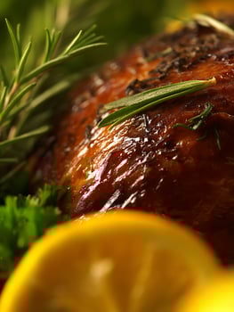 Close up of Roasted Chicken with Rosemary and Lemon. A delicious image perfect for culinary websites, cookbooks, and food blogs. photo