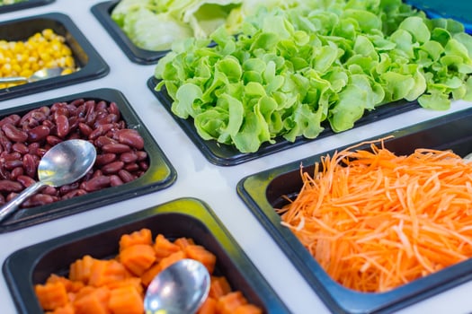 A tray of food with vegetables and beans photo