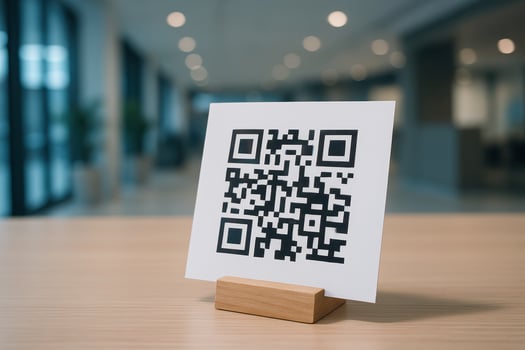 QR code on white card in wooden holder on table for digital scan and information photo