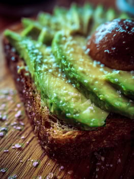 Close Up of Avocado Toast with Sea Salt on Wooden Board. photo