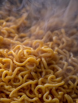 Close Up of Steaming Noodles, Golden Broth, Food Photography. photo