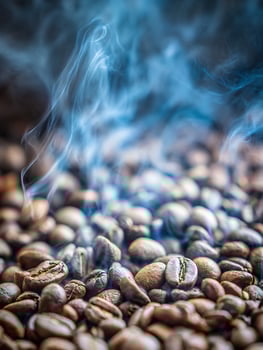 Aromatic Coffee Beans with Rising Steam Close Up Photography. photo