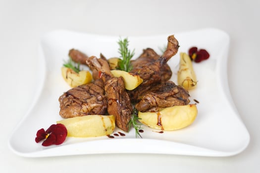potatoes duck leg Chicken thighs grilled on hot barbecue charcoal flaming grill with sauce brushed on top. Juicy chicken meat roasted on bbq grill. slow motion photo