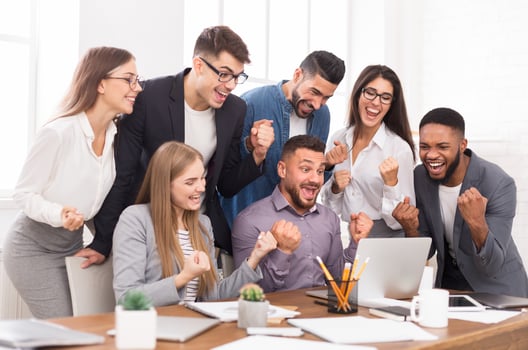 Success and team work. Business partners celebrating breakthrough in their company photo