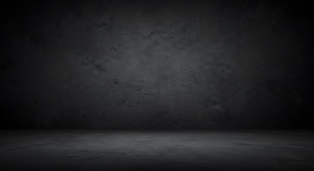Dark room with concrete floor and wall photo