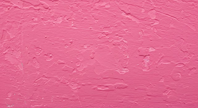 A pink wall with a white paint photo