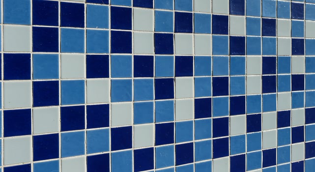 A blue and white tiled wall photo