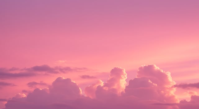 A pink sky with clouds and a pink sunset photo