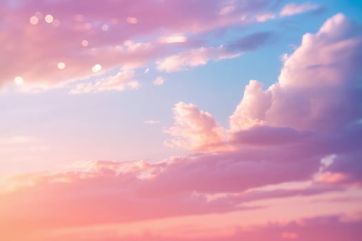 Dreamy pastel sky with soft pink and purple clouds at sunset photo