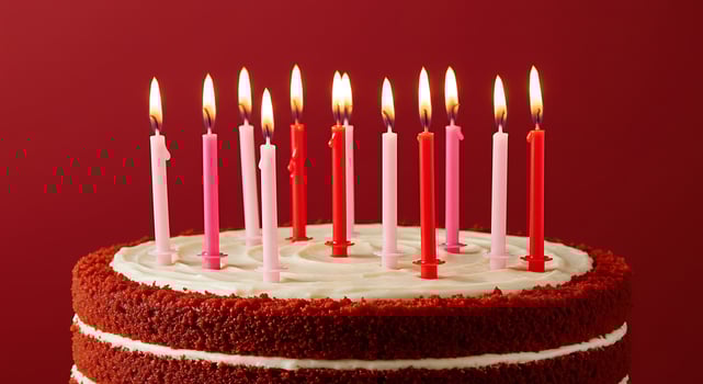A red cake with candles on it photo