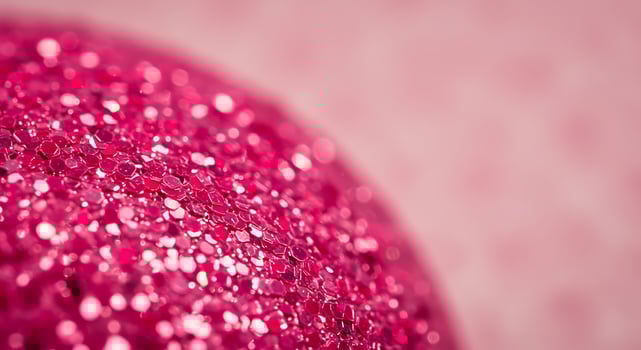A pink glitter ball with a pink background photo
