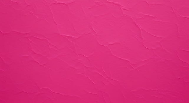 A pink wall with a texture of paper photo