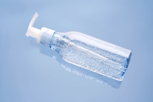 Tube of micellar gel ion a blue background. photo