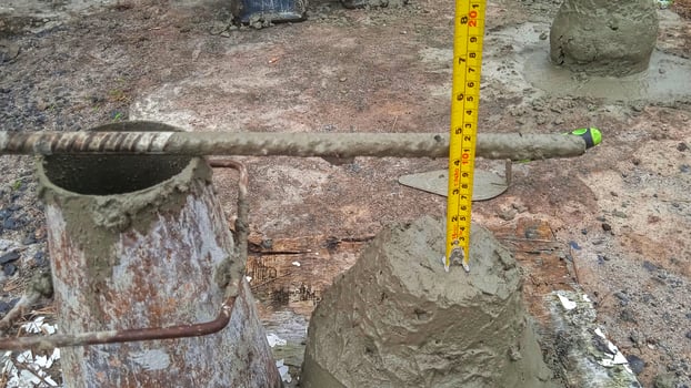 A concrete pipe with a measuring tape on it photo
