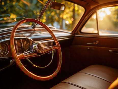 The interior of a classic car with the sun shining photo