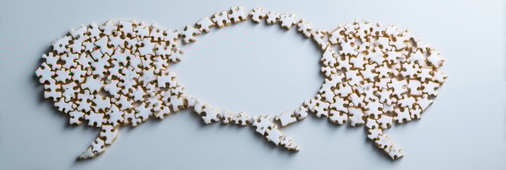 Puzzle Pieces Combining to Create a Speech Bubble Symbolizing Teamwork and Communication With a Clean Minimal Background photo